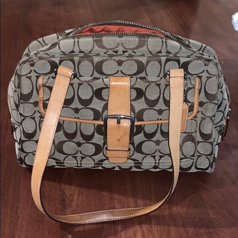 Coach purse with tan logo print and brown leather